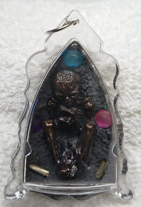 Guman Thong - takrut, gemstones and gold film.